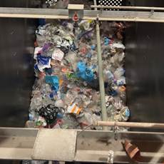 The sorted plastic is collected in different containers.